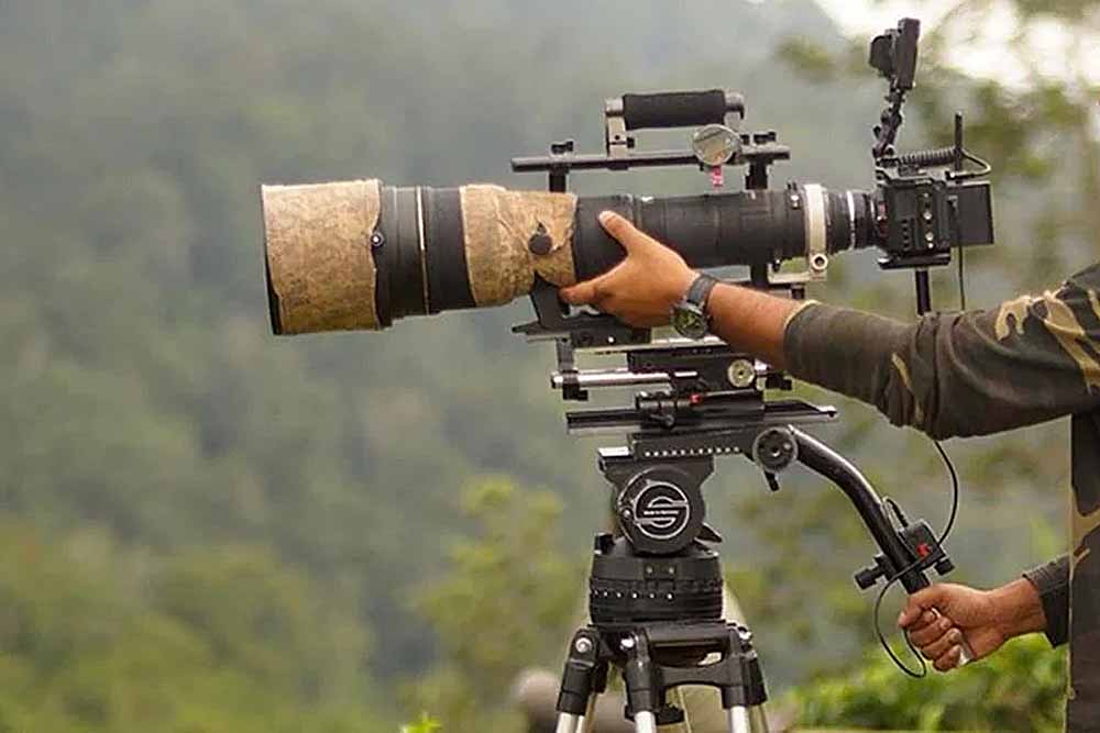 Video camera and long lens setup of tripod