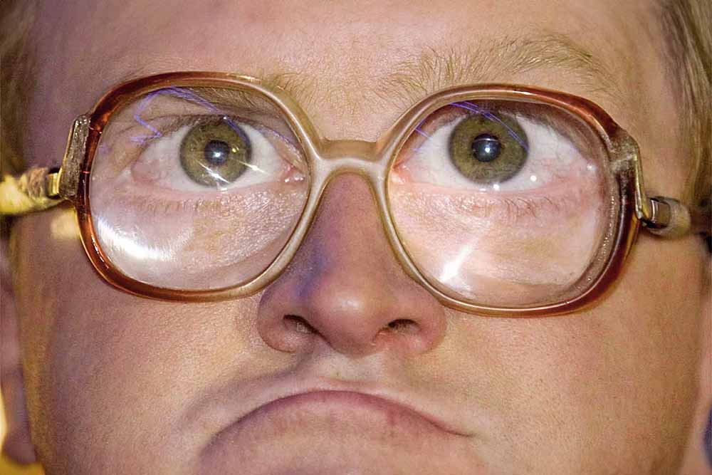 Man with thick glasses